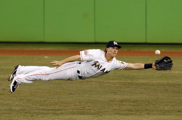 Chris Coghlan stretches for a ball 