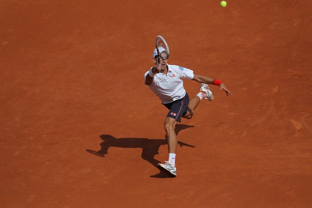 Novak Djokovic returns in his first round match against Potito Starace 