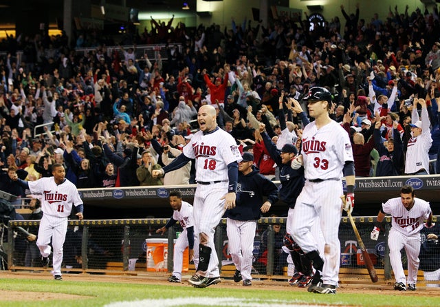 Twins players react as Josh Willingham hits a three-run home run 