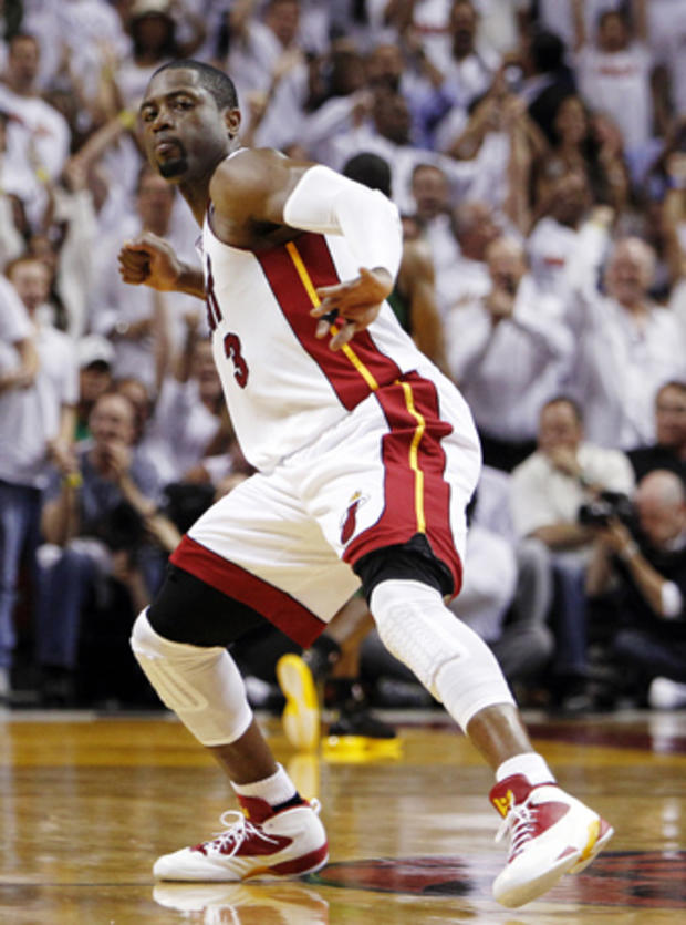 Dwyane Wade pumps his fist after the Heat scored 