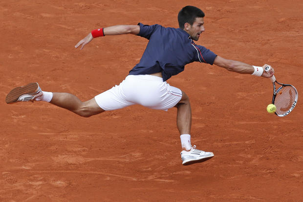Novak Djokovic returns in his fourth round match 