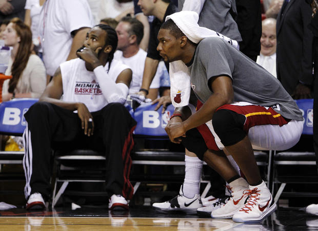 Chris Bosh watches from the bench during the closing seconds 