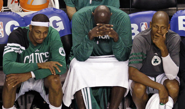 Paul Pierce, Kevin Garnett and Ray Allen sit on the bench 