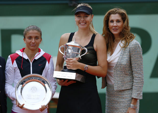 Maria Sharapova and Sara Errani hold their trophies received 