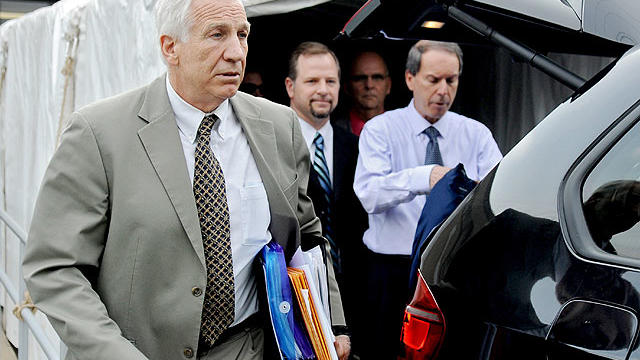 Former Penn State University assistant football coach Jerry Sandusky walks out of Centre County Courthouse after the first day of trial, in Bellefonte, Pa., Monday, June 11, 2012.  