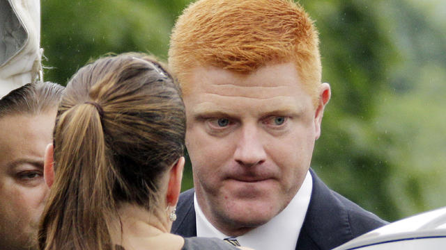 Penn State University assistant football coach Mike McQueary arrives at the Centre County Courthouse  