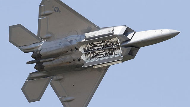 In this April 30, 2012, file photo, an Air Force F-22 Raptor displays it's weapons bays as it goes through maneuvers during a demonstration at Langley Air Force Base in Hampton, Va., Monday, April 30, 2012. 