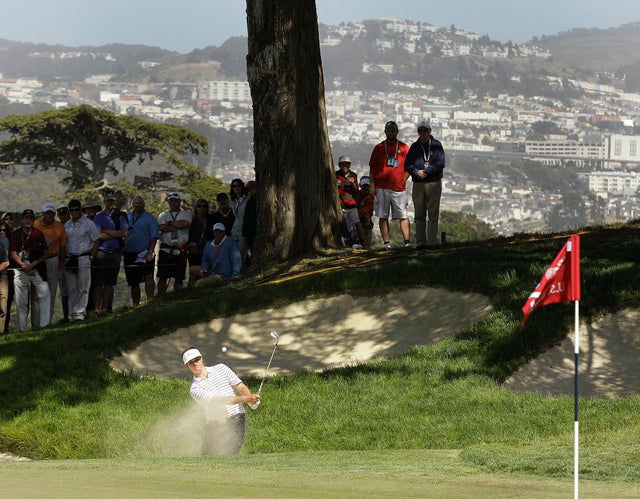 Amateur Beau Hossler hits out of a bunker 