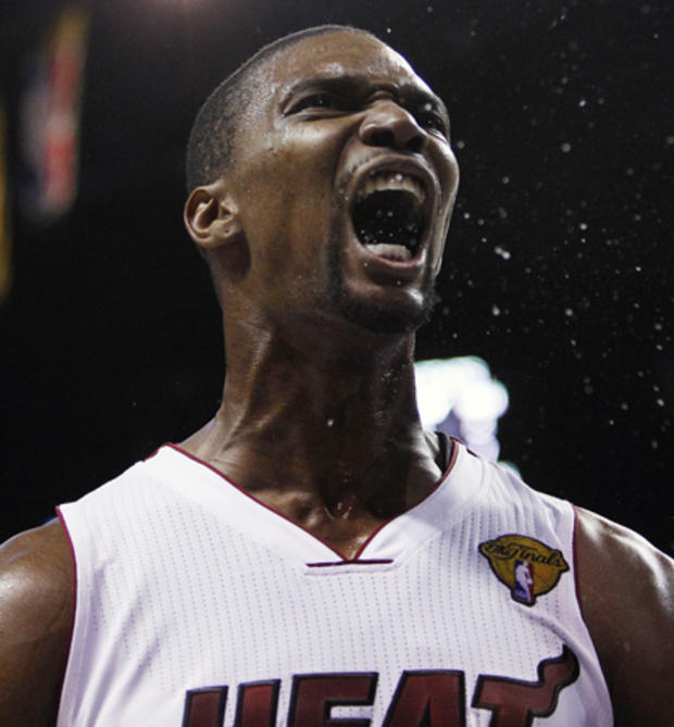 Chris Bosh (1) reacts after diving for a loose ball  