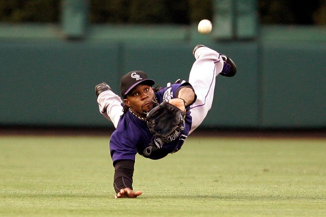 Eric Young makes a diving catch on a fly ball 