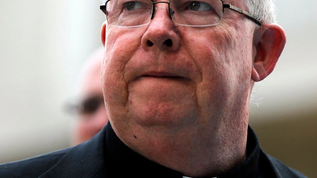Monsignor William Lynn walks to the Criminal Justice Center June 19, 2012, in Philadelphia. 
