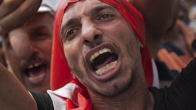 Egyptian supporters of the Muslim Brotherhood's candidate for president, Mohammed Morsi, attend Friday prayers in Tahrir Square, Cairo, Egypt, Friday, June 22, 2012.  