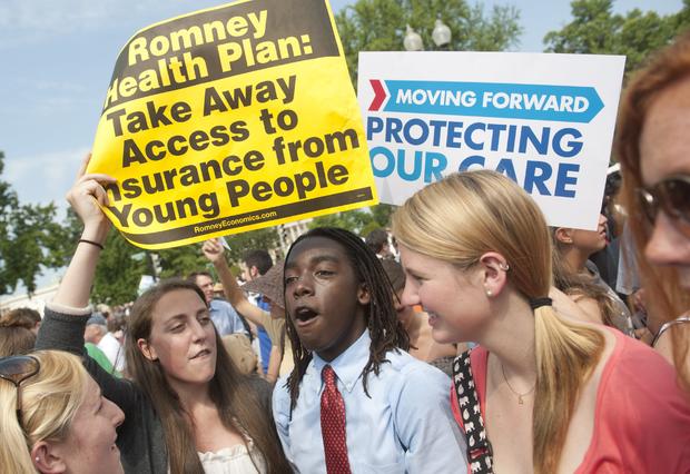 Supporters of US President Barack Obama's signature healthcare legislation celebrate  