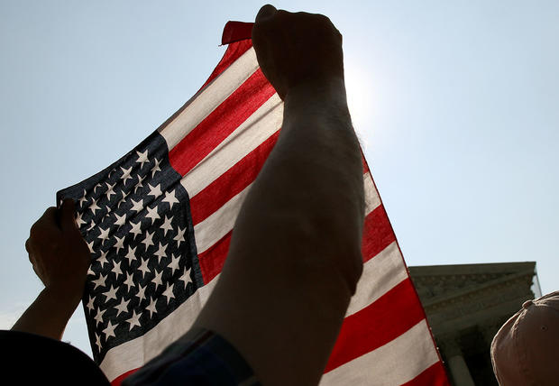 A protester holds an American flag during a demonstration 