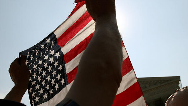 A protester holds an American flag during a demonstration 