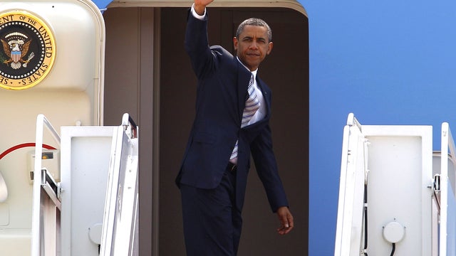 President Barack Obama waves as he boards Air Force One before departing to Colorado, Friday, June 29, 2012, at Andrews Air Force Base, Md. 