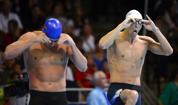 Ryan Lochte, left, and Michael Phelps prepare to swim 