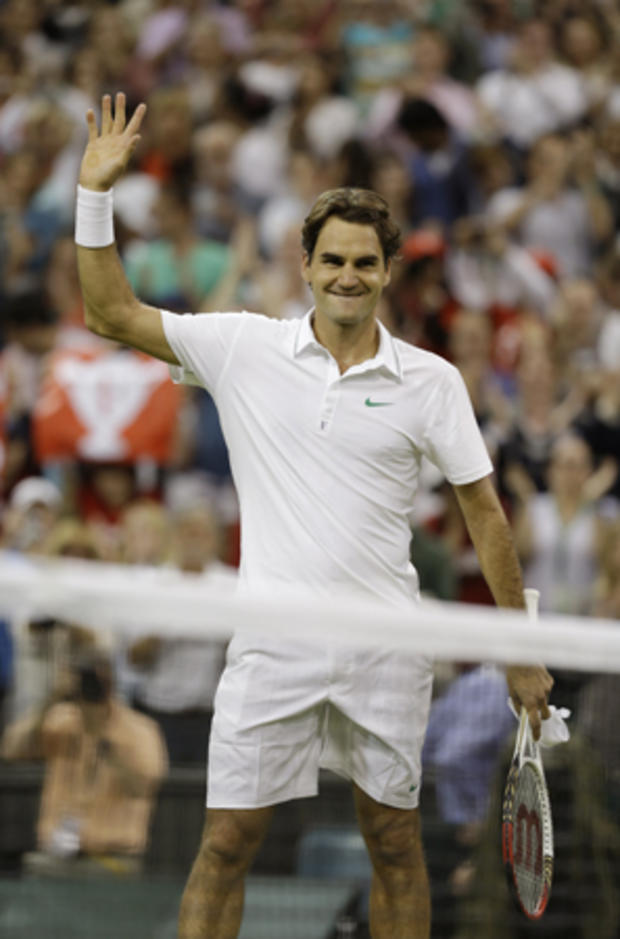 Roger Federer reacts after winning a third round men's singles match 