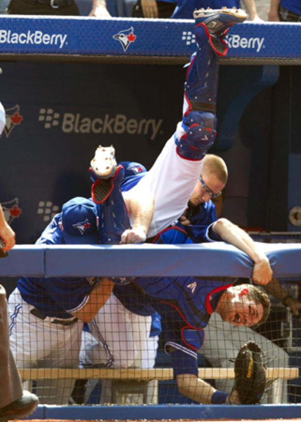 J.P. Arencibia is caught by coaches  