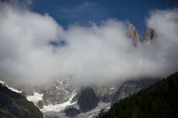 Clouds billow over the French Alps where an avalanche in the mountains near Chamonix, France, swept at least nine climbers to their deaths, Thursday, July 12, 2012. About 28 climbers from Switzerland, Germany, Spain, France, Denmark and Serbia were believed to be involved in the expedition caught in the avalanche, according to the local gendarme service and Danish Foreign Ministry.