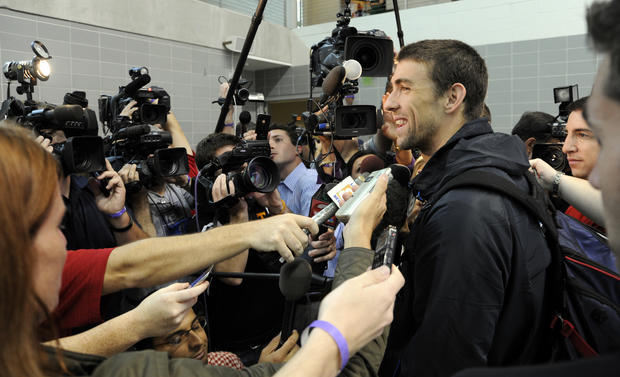 Michael Phelps is interviewed by the media  