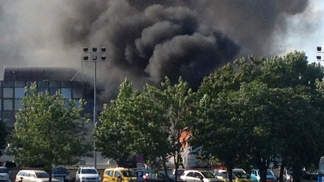 Smoke rises into the sky after an explosion at Burgas airport, outside the Black Sea city of Burgas, Bulgaria, some 400 kilometers (250 miles) east of the capital, Sofia, Wednesday, July 18, 2012.  