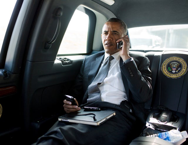 President Barack Obama talks on the phone with Aurora Mayor Steve Hogan during the motorcade ride to Palm Beach International Airport in Palm Beach, Fla., July 20, 2012. The President called Mayor Hogan to offer his condolences and support to the Aurora c