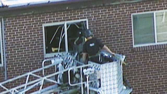 Will authorities blow up booby-trapped apartment? 