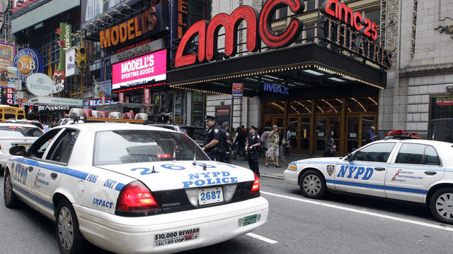 Police officers are seen outside a movie theater screening â 