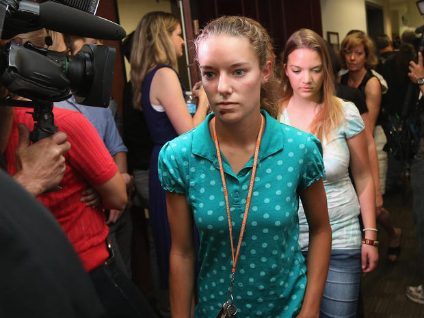 Victim McKayla Hicks, who was shot in the face, along with family members of the victims of last Friday's movie theater mass shooting arrive at the Arapahoe County Courthouse for James Holmes' first court appearance July 23, 2012 in Centennial, Colorado. 