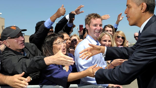 President Obama greets people after arriving at Oakland International Airport in Oakland, Calif., July 23, 2012. 