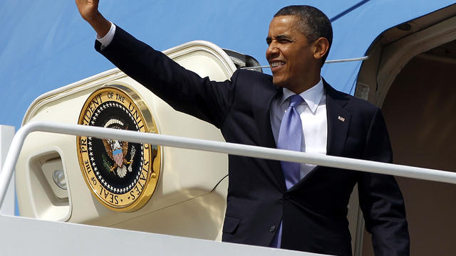 President Obama waves as he boards Air Force One before his departure from Andrews Air Force Base, Md., July 30, 2012. 