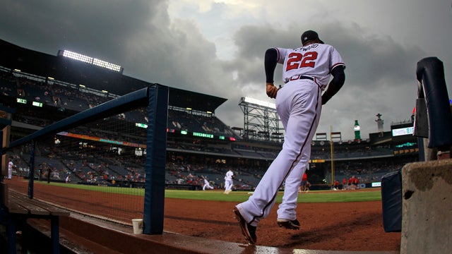 Jason Heyward runs to his position during the third inning  