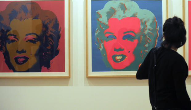 A visitor looks at Andy Warhol's paintings from the serie "Marilyn Monroe, 1969" 