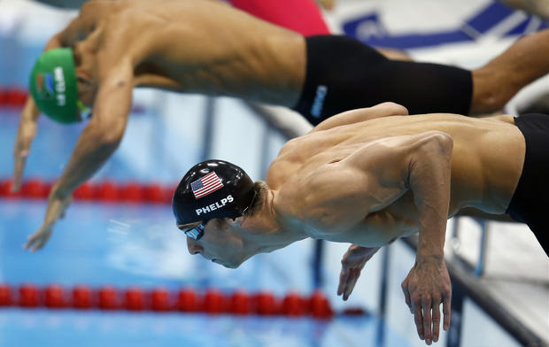 Michael Phelps take the start take the start in the men's 100-meter  
