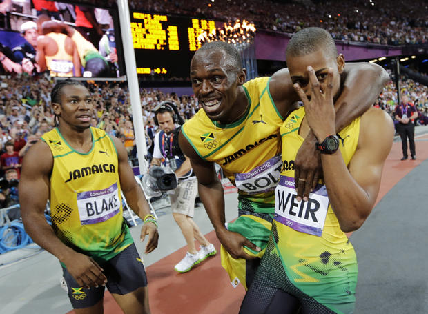 Jamaica's Usain Bolt, center, Jamaica's Yohan Blake, left, and Jamaica's Warren Weir celebrate their medals 