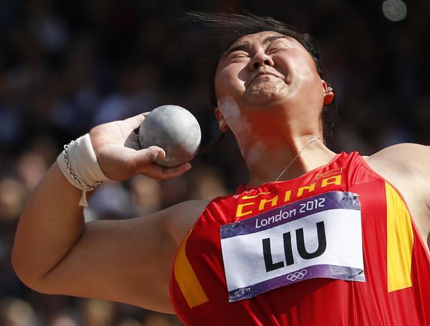 China's Liu Xiangrong takes a thrown a women's shot put qualification 