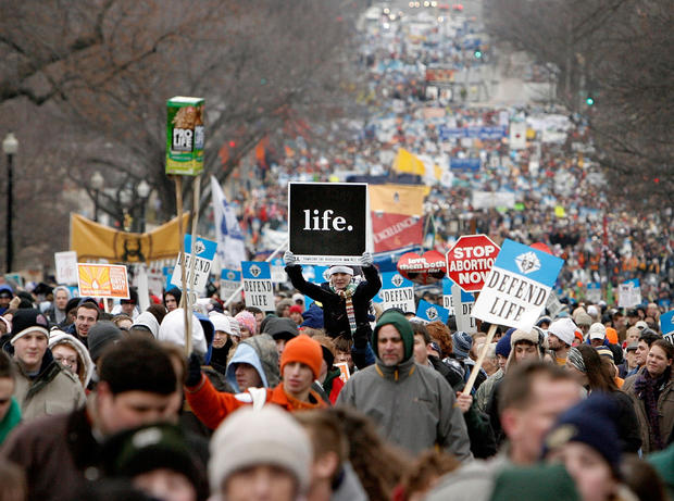 Thousands of anti-abortion demonstrators participating in the 'March for Life' walk up to Capitol Hill along Constitution Avenue on their way to the Supreme Court building January 22, 2008 in Washington, DC. 