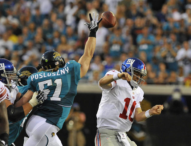 Eli Manning has his pass tipped by Paul Posluszny 