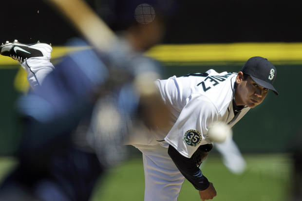 Felix Hernandez throws against the Tampa Bay Rays  
