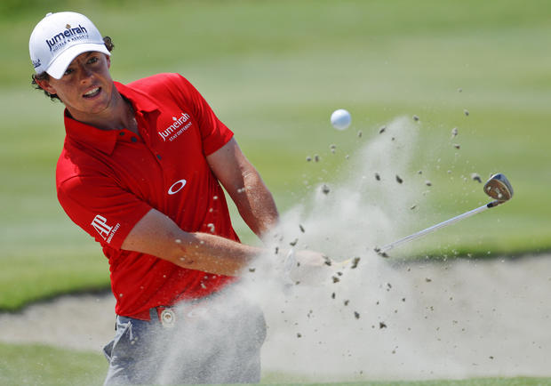 Rory McIlroy, of Northern Ireland, hits out of the sand 