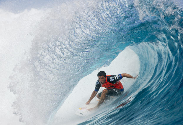 Adriano De Souza, of Brazil, competes in round one at the Billabong Pro Tahiti surfing event 