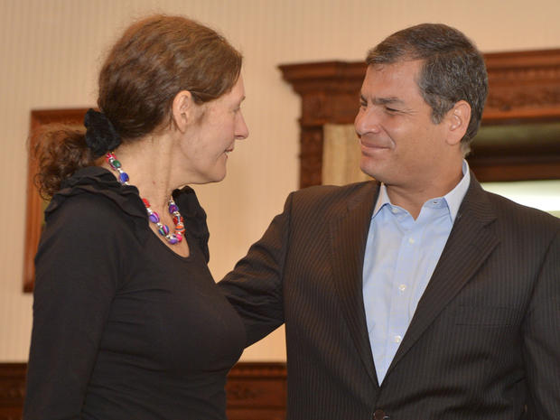 Ecuadorean President Rafael Correa greets Christine Assange 