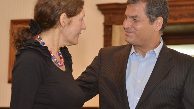 Ecuadorean President Rafael Correa greets Christine Assange 