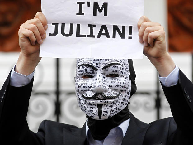 A supporter of WikiLeaks founder Julian Assange holds up a placard outside the Ecuadorian Embassy in London Aug. 16, 2012. 