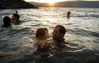 Israeli tourists enjoy the water at the Sea of Galilee lake in Israel Aug. 22, 2006. 