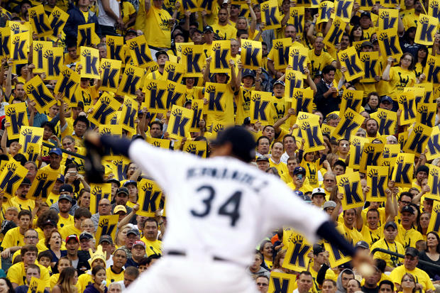 Fans stand to cheer as Seattle Mariners starting pitcher Felix Hernandez 