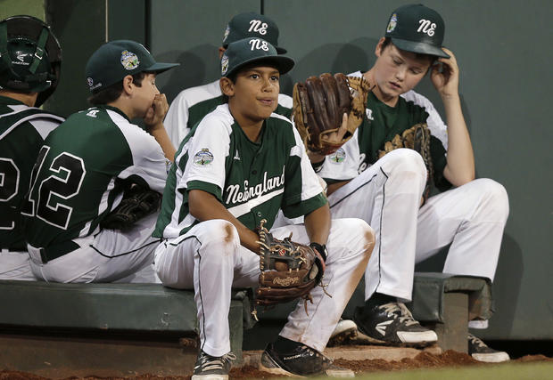 Kevin Oricoli, left, Michael Ghiorzi, center, and pitcher Matt Kubel sit on the dugout steps 