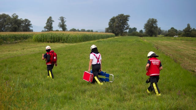 Rescuers at hot air balloon crash site 