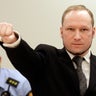 Mass murderer Anders Behring Breivik makes salute after he arrives at court in Oslo Friday Aug. 24, 2012 . Breivik has been declared sane and sentenced to prison for bomb and gun attacks that killed 77 people last year. 